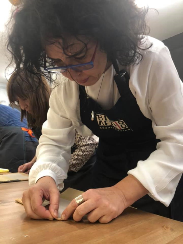 Thessaloniki 28 Oct 2019 - Putting glue to tide the sheets of the book Thessaloniki 28 Oct 2019 - Putting glue to tide the sheets of the book